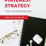 Text reads: "How To Create A Pinterest Strategy For Your Business" with a black notebook sitting on a counter.