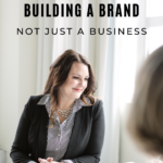 Woman sitting at a desk. Copy Reads: "Building a Brand, Not Just a Business. Listen In."