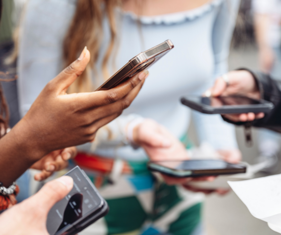 People holding phones.